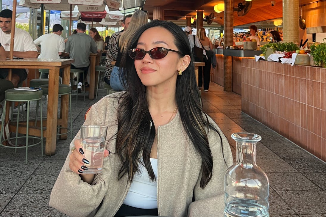 Woman sitting at rooftop bar